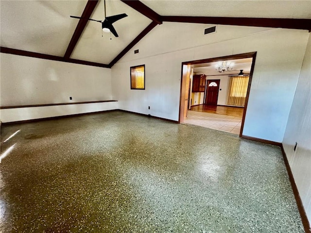 spare room with lofted ceiling with beams and ceiling fan with notable chandelier