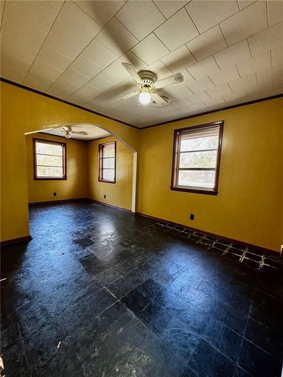 spare room with ceiling fan