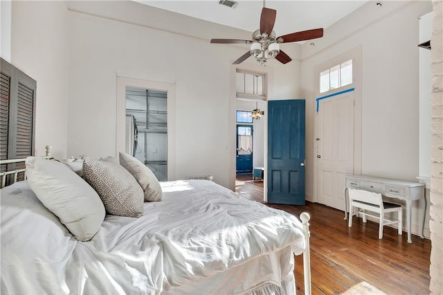 bedroom featuring ceiling fan and dark wood-type flooring