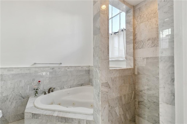 bathroom with tiled tub