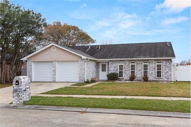 ranch-style house featuring a front lawn and a garage