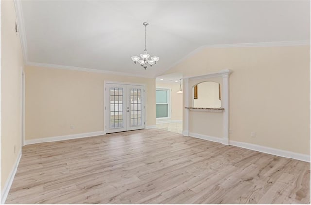 unfurnished living room featuring a notable chandelier, light hardwood / wood-style flooring, french doors, and ornamental molding