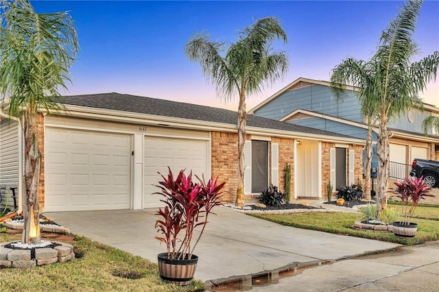 ranch-style home featuring a garage