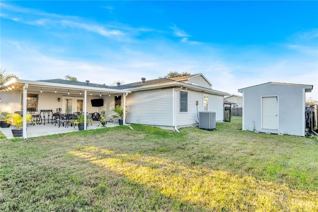 back of property featuring a lawn, central AC, a storage shed, and a patio