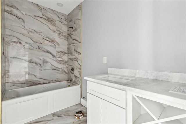 bathroom featuring vanity and tiled shower / bath combo