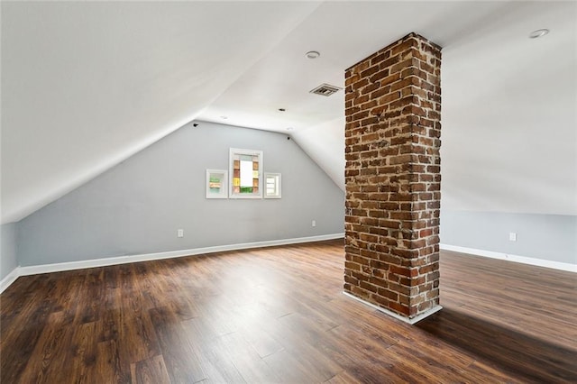 bonus room featuring hardwood / wood-style floors and vaulted ceiling