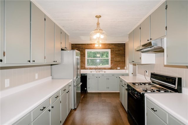 kitchen featuring range with gas cooktop, hanging light fixtures, dark hardwood / wood-style flooring, high end fridge, and sink