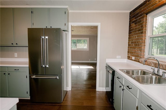 kitchen with dark hardwood / wood-style flooring, high end refrigerator, ornamental molding, black dishwasher, and sink