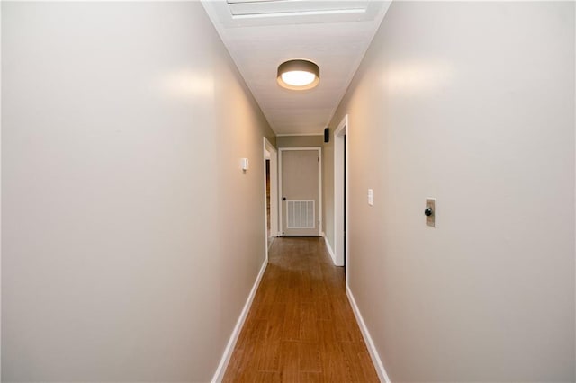 corridor with light hardwood / wood-style flooring