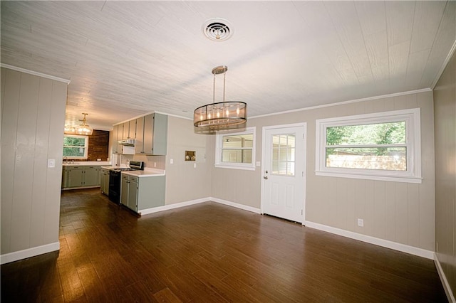 interior space featuring a notable chandelier, dark hardwood / wood-style flooring, and crown molding