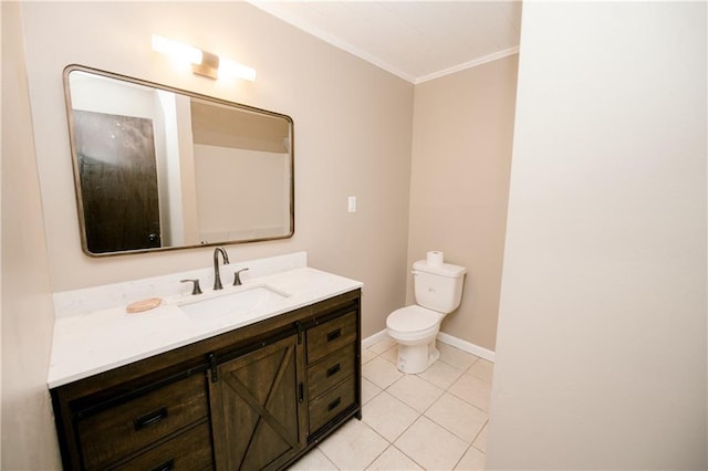 bathroom with toilet, vanity, tile patterned flooring, and ornamental molding