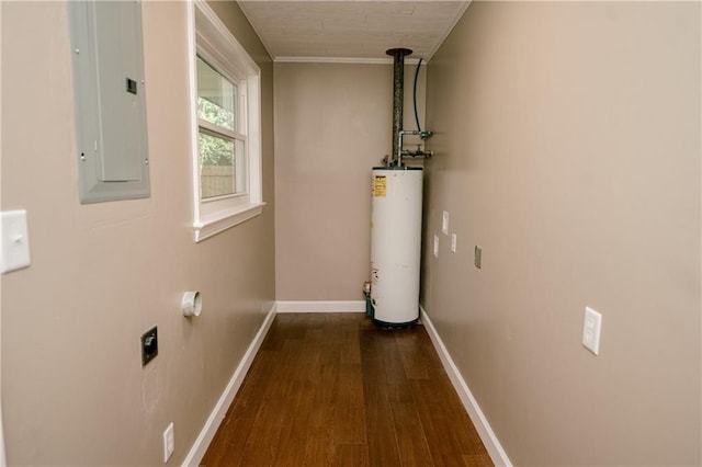 laundry area featuring electric panel, hookup for an electric dryer, gas water heater, crown molding, and dark wood-type flooring