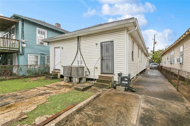 back of property with cooling unit