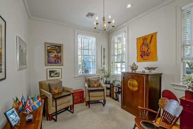 sitting room featuring ornamental molding and an inviting chandelier