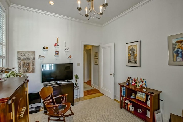 living room featuring light wood-type flooring, an inviting chandelier, ornamental molding, and plenty of natural light