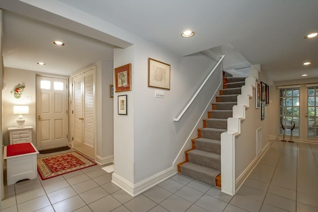 entryway featuring light tile patterned flooring