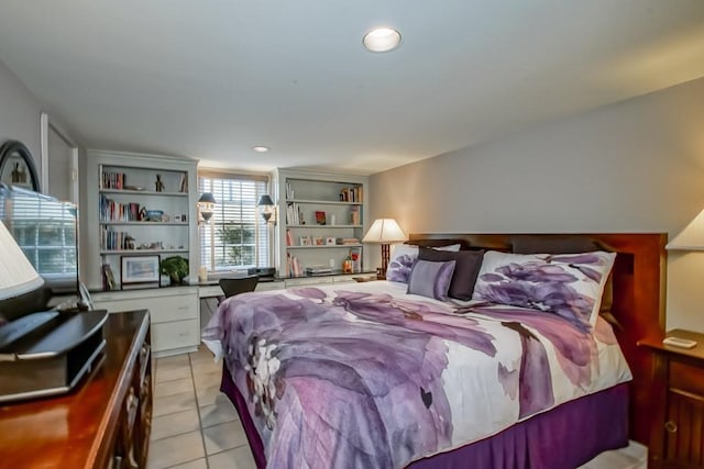 bedroom with light tile patterned floors