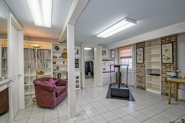 exercise room with light tile patterned floors