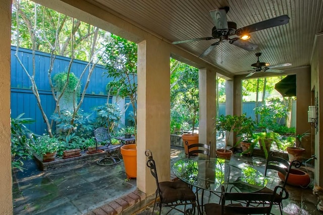 view of patio featuring ceiling fan