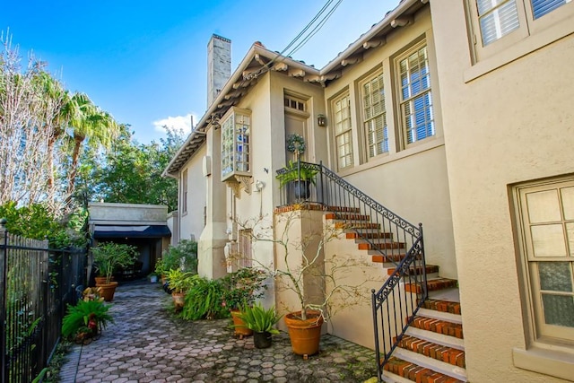 view of side of property featuring a patio