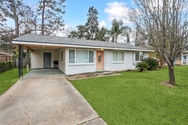 ranch-style home with a front lawn and a carport