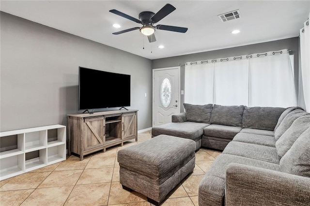 tiled living room featuring ceiling fan