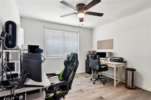 home office featuring ceiling fan and light hardwood / wood-style flooring