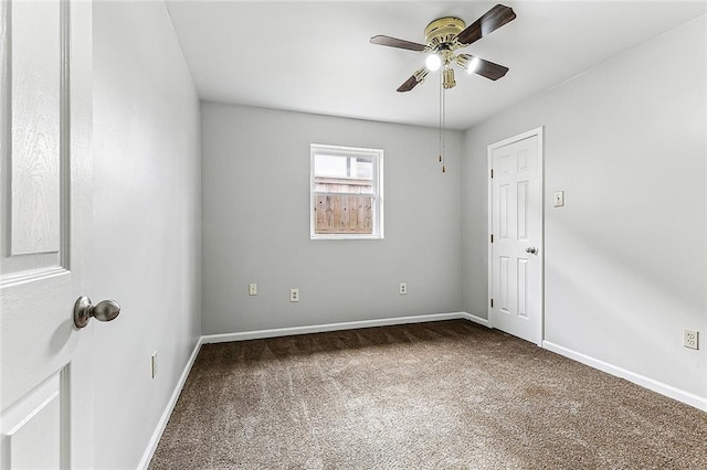 empty room with carpet floors and ceiling fan