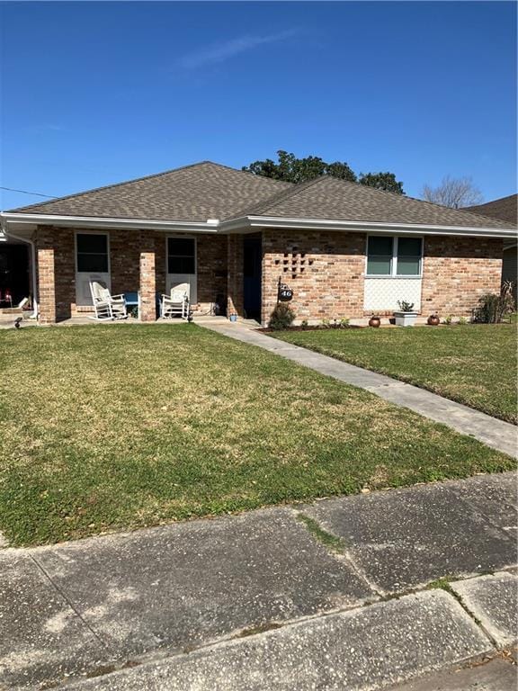 46 Donelon Dr, Harahan, LA 70123 - ranch-style house featuring brick siding and a front yard