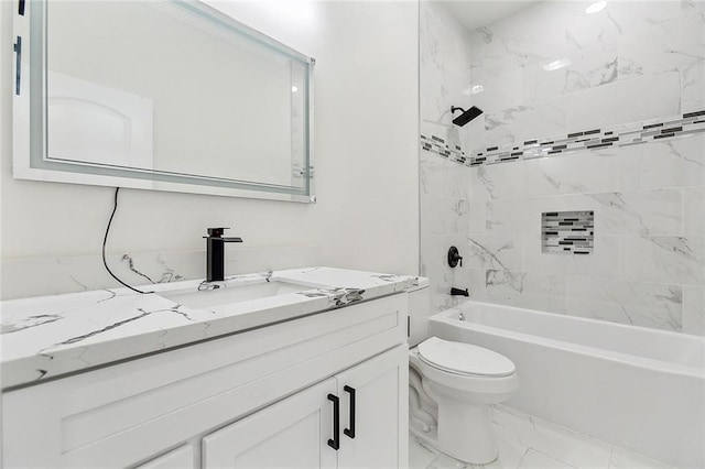 full bathroom with toilet, vanity, and tiled shower / bath combo