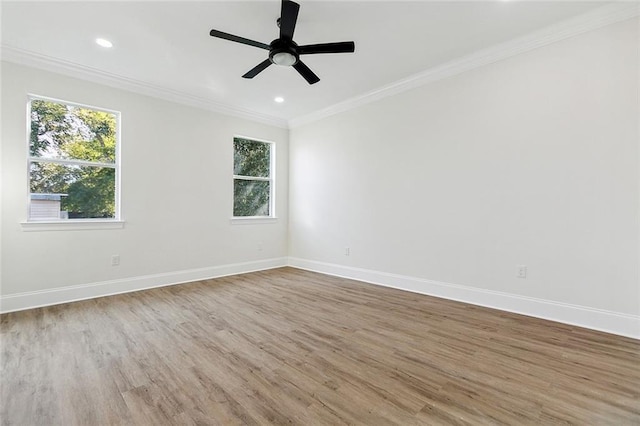 unfurnished room featuring wood-type flooring, ornamental molding, and ceiling fan