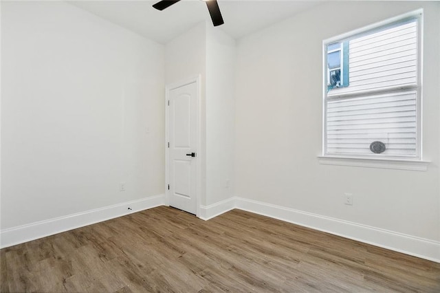 unfurnished room featuring ceiling fan and hardwood / wood-style flooring