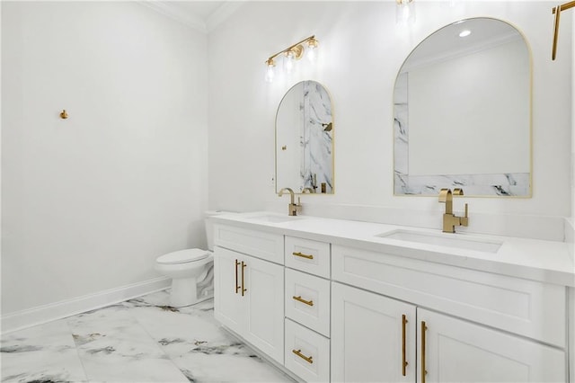 bathroom with ornamental molding, toilet, and vanity