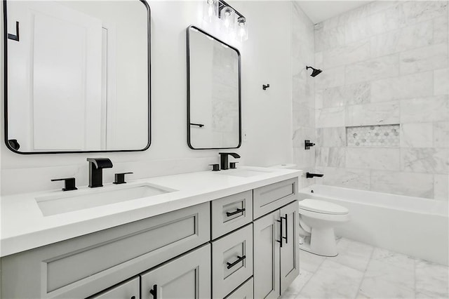 full bathroom with vanity, tiled shower / bath combo, and toilet