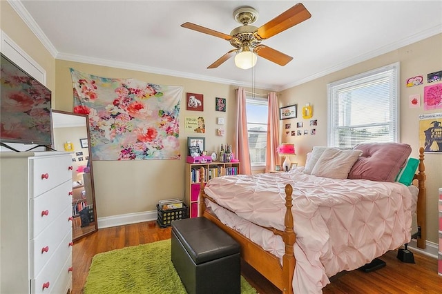 bedroom with hardwood / wood-style flooring, ceiling fan, and crown molding