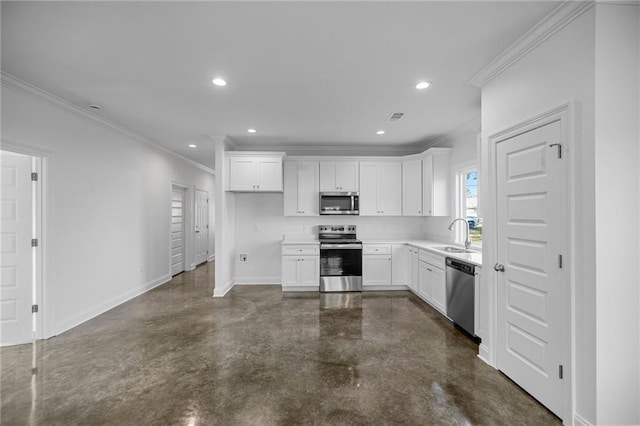 kitchen with appliances with stainless steel finishes, white cabinetry, ornamental molding, and sink