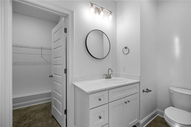 bathroom with toilet and vanity