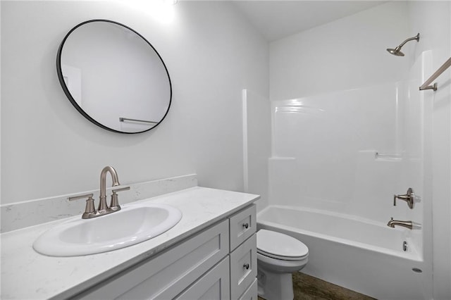 full bathroom with tub / shower combination, vanity, and toilet