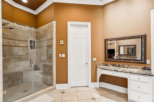 bathroom featuring walk in shower, vanity, crown molding, and tile patterned floors