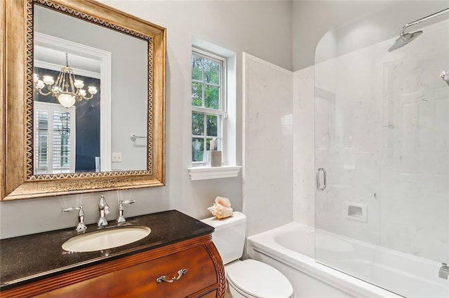 full bathroom featuring toilet, bath / shower combo with glass door, an inviting chandelier, and vanity