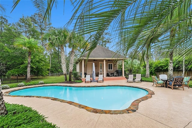 view of pool featuring a patio and ceiling fan