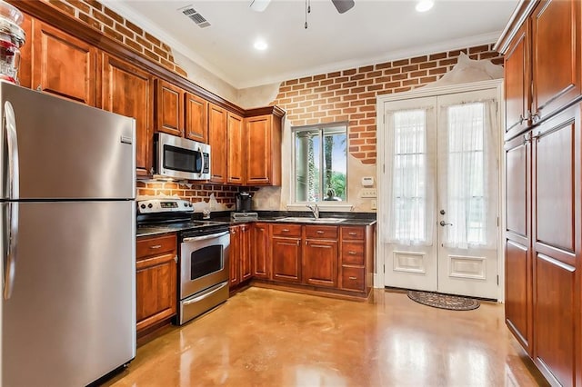 kitchen featuring sink, stainless steel appliances, french doors, and crown molding