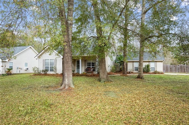 single story home featuring a front lawn