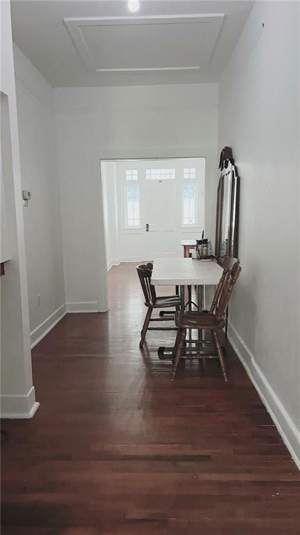 dining area featuring baseboards and wood finished floors