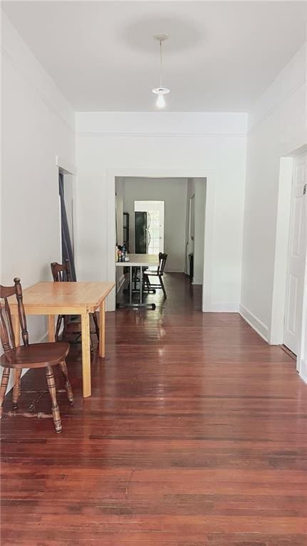 dining area with wood finished floors