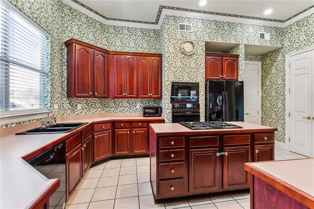 kitchen with black appliances, a kitchen island, crown molding, light tile patterned flooring, and sink