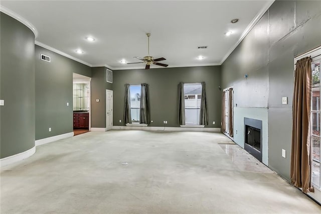 unfurnished living room with ceiling fan and ornamental molding