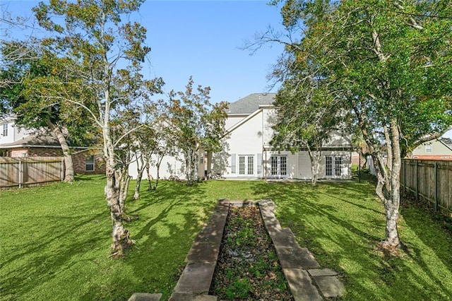 view of yard with french doors