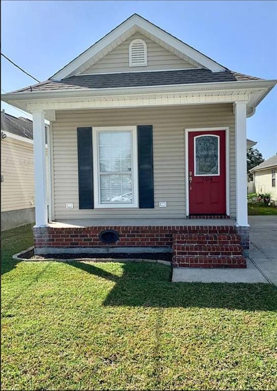 bungalow with a front lawn