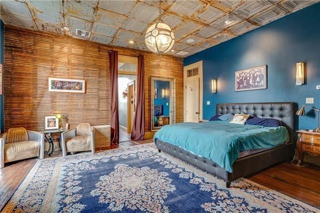 bedroom with hardwood / wood-style flooring